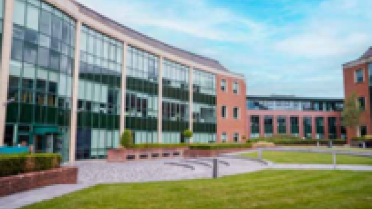 Modern office building in green space.